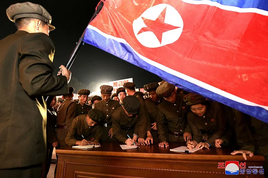 Young people, including students and youth league officials, sign petitions to join or return to the army, according to North Korean state media, at an undisclosed location in North Korea, in this undated photo released by North Korea’s official Korean Central News Agency on 16 October 2024.