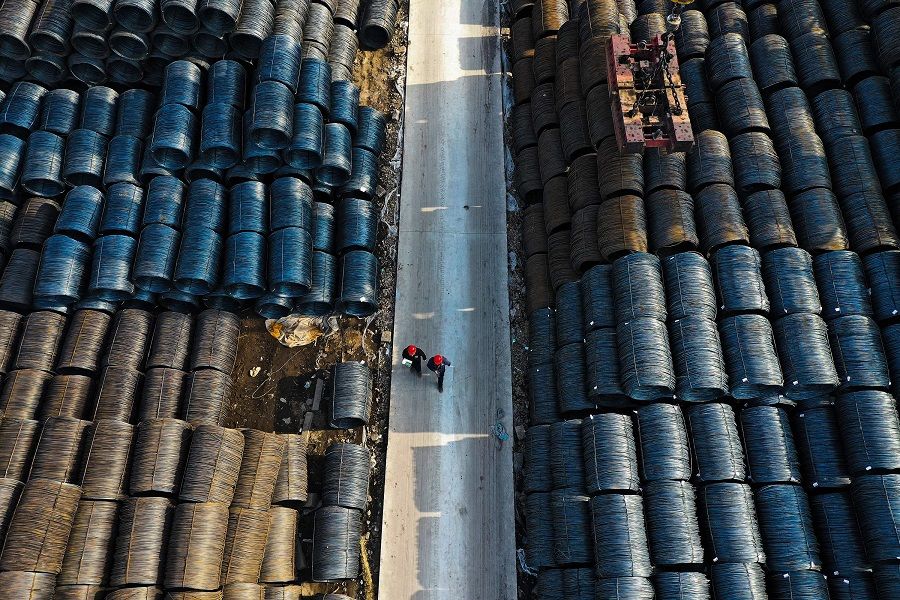  An aerial view shows people walking at a wholesale steel market in Shenyang, in northeastern China’s Liaoning province on 11 April 2024.  (AFP)
