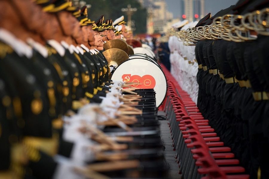 A Chinese military band prepares for celebrations in Beijing on 1 July 2021, to mark the 100th anniversary of the founding of the Communist Party of China. (Wang Zhao/AFP)