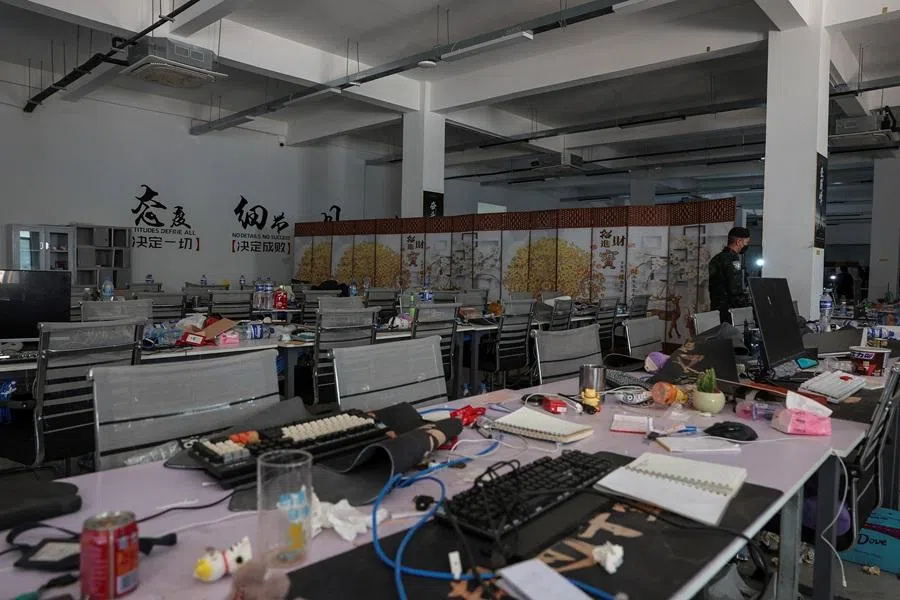 A Thai soldier walks inside a workstation inside a compound in O'Smach used for scam operations, at the Chong Chom-O'Smach border crossing, which was bombed and occupied by the Thai military in December following clashes between Thailand and Cambodia along a disputed border area, in Samraong, Oddar Meanchey province, Cambodia, 7 April 2026. (Chalinee Thirasupa/Reuters)