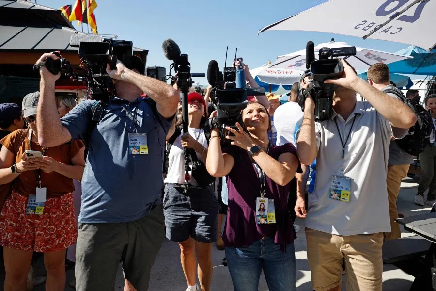 Video journalists cover former US Vice President and current presidential candidate Mike Pence during one of Iowa Governor Kim Reynolds' "Fair-side Chats" at the Iowa State Fair on 10 August 2023 in Des Moines, Iowa. (Chip Somodevilla/Getty Images/AFP)