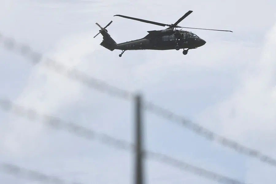 A UH-60 Black Hawk helicopter flies over during a military exercise at the Hengchun Airport in Pingtung county, southern Taiwan, 9 August 2022. (Reuters/Ann Wang)