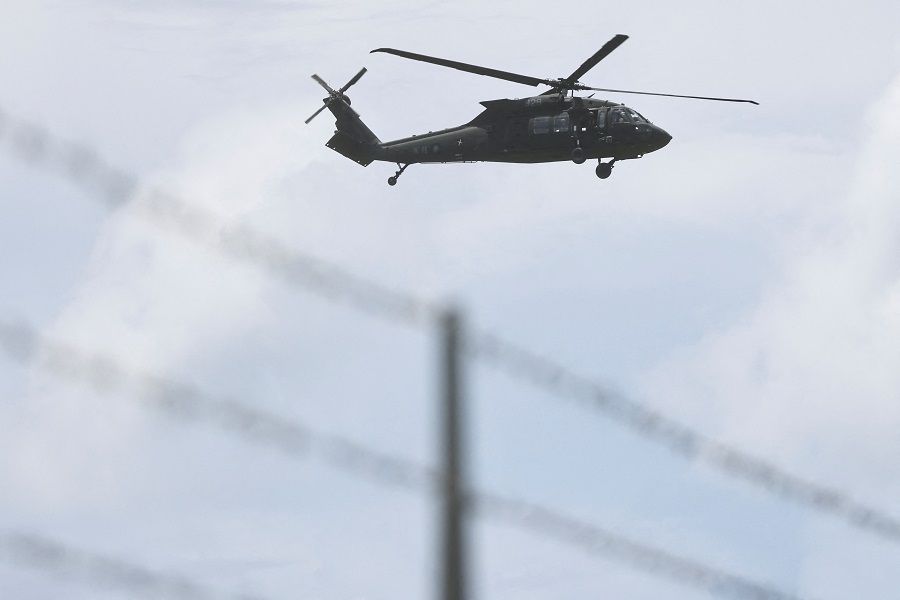 A UH-60 Black Hawk helicopter flies over during a military exercise at the Hengchun Airport in Pingtung county, southern Taiwan, 9 August 2022. (Reuters/Ann Wang)