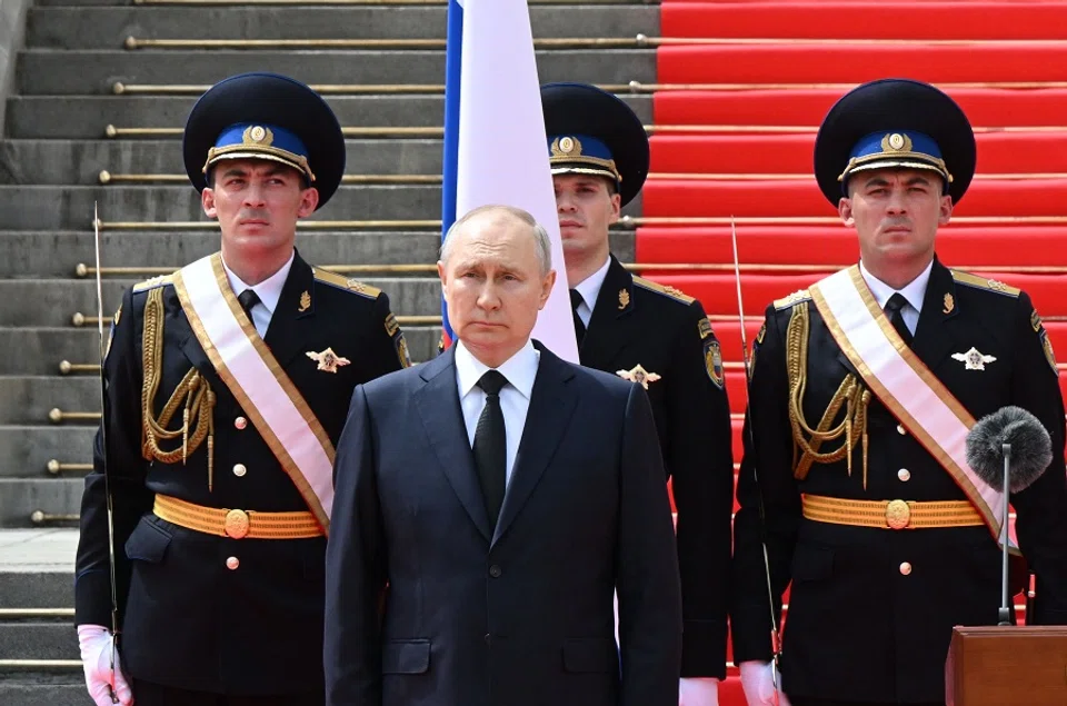 Russian President Vladimir Putin holds a minute of silence for pilots killed in clashes with the mutineers during a revolt by Wagner mercenaries as he addresses troops from the defence ministry, National Guard, FSB security service and interior ministry gathered on the Cathedral Square at the Kremlin in Moscow, Russia, on 27 June 2023. (Sergei Guneyev/Sputnik/AFP)