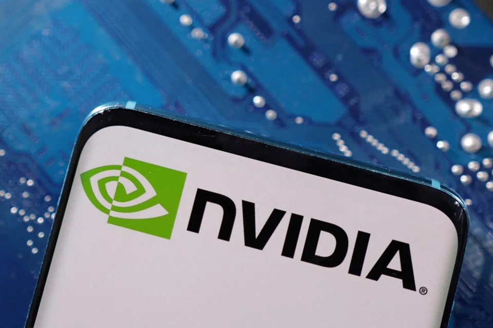 A smartphone with a displayed Nvidia logo is placed on a computer motherboard in this illustration taken 6 March 2023. (Dado Ruvic/Reuters)
