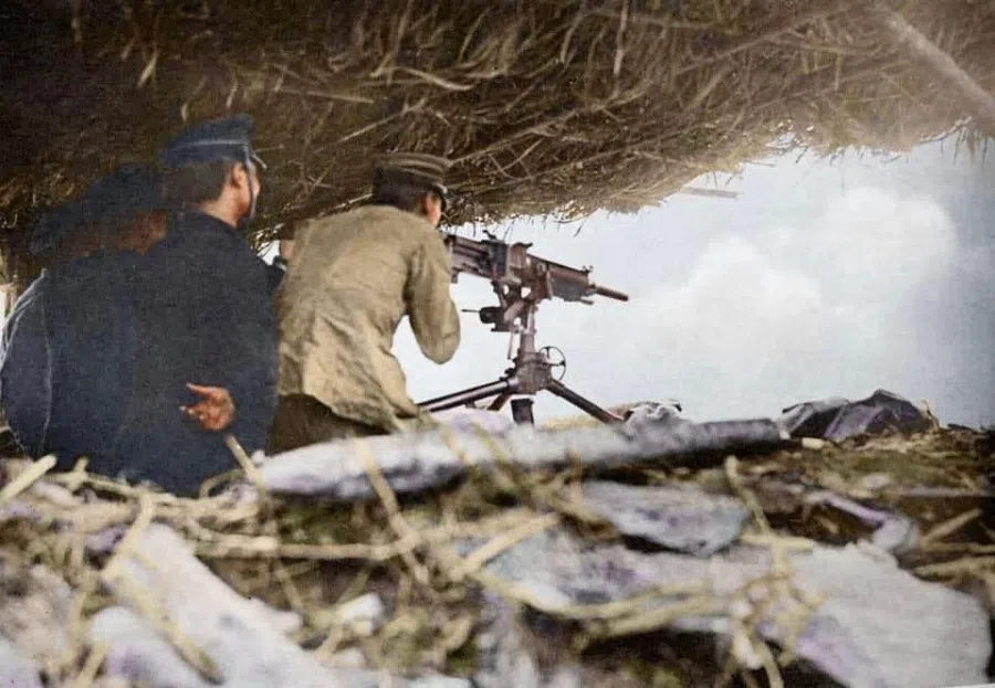 Japanese troops firing with a heavy machine gun on a resisting indigenous tribal village, 1930.