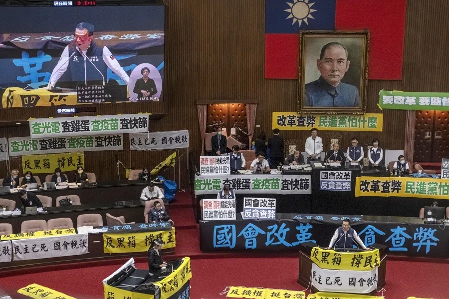 Kuomintang (KMT) lawmakers gather around Han Kuo-yu, speaker of the Legislative Yuan, center, during a protest by Democratic Progressive Party (DPP) lawmakers at the Legislative Yuan in Taipei, Taiwan, on 24 May 2024.  (Lam Yik Fei/Bloomberg)