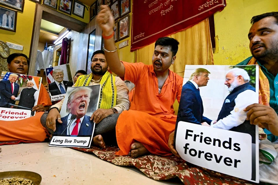 Members of Hindu Sena, a right-wing organisation, hold posters of former US President Donald Trump and perform rituals alongside idols of Hindu deities during a special prayer meet for the long life of Trump, in New Delhi, India, on 16 July 2024. (Money Sharma/AFP)