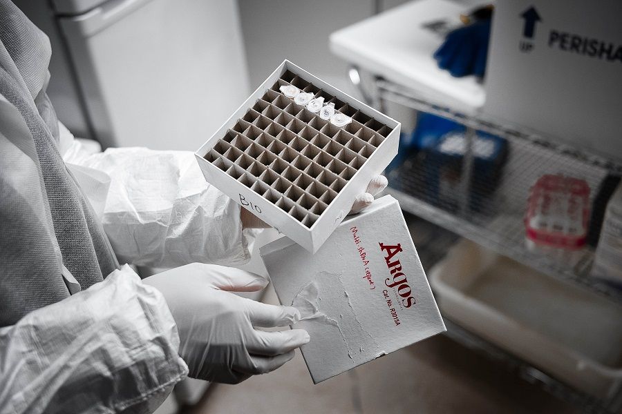 A Mirimus Inc lab scientist holds Covid-19 samples from recovered patients on 10 April 2020 in the Brooklyn borough of New York City. (Misha Friedman/Getty Images/AFP)