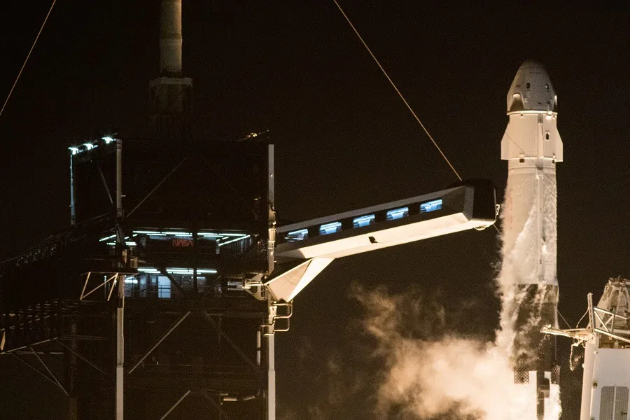 A SpaceX Falcon 9 rocket, topped with the Crew Dragon capsule, is launched carrying four astronauts on the first operational NASA commercial crew mission at Kennedy Space Center in Cape Canaveral, Florida, US, 15 November 2020. (NASA/Joel Kowsky/Handout via Reuters)