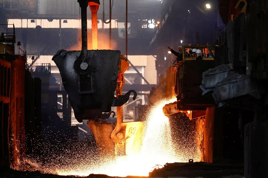 Workers monitor a nickel smelter in Indonesia, on 30 March 2023. (Ajeng Dinar Ulfiana/Reuters)