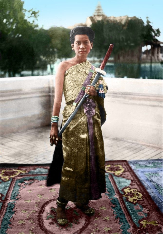 A female palace guard with a sword, Phnom Penh, 1920s.