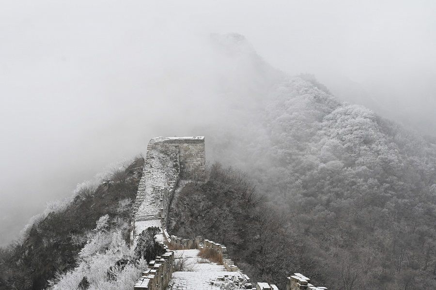 The Great Wall of China is seen after a light snowfall at Jiankou, north of Beijing, China, on 9 January 2022. (Greg Baker/AFP)