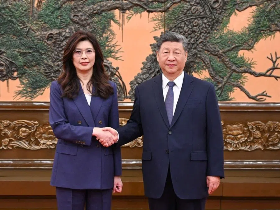 This handout photo taken and released on 10 April 2026, by the office of Kuomintang (KMT) shows Kuomintang chairperson Cheng Li-wun (left) shaking hands with Chinese President Xi Jinping (right) at the Great Hall of the People in Beijing. (Handout/The Office of Kuomintang (KMT) lawmaker Johnny Chiang/AFP)
