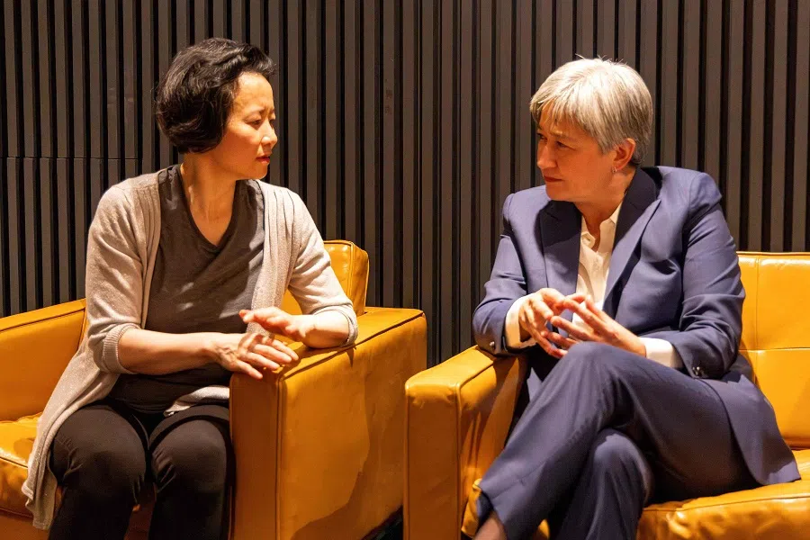 This handout photograph taken on 11 October 2023 and released by Australia's Department of Foreign Affairs and Trade shows Australian Foreign Minister Penny Wong (right) speaking with Australian journalist Cheng Lei upon her arrival at the airport in Melbourne. (Sarah Hodges/Australia's Department of Foreign Affairs and Trade (DFAT)/AFP)