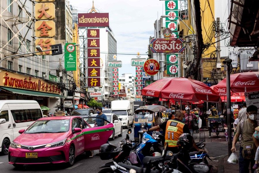 A man enters a taxi in the Chinatown district of Bangkok on 9 November 2021. (Jack Taylor/AFP)