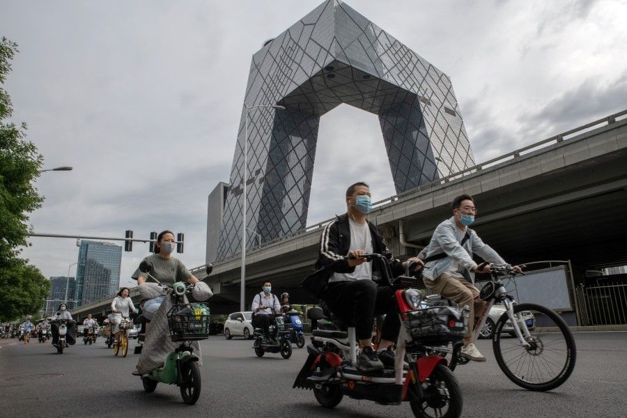 Motorists travel past the China Central Television Tower in Beijing, China, on Tuesday, 7 June 2022. (Bloomberg)
