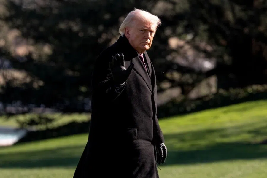US President Donald Trump walks on the South Lawn of the White House after arriving on Marine One in Washington, DC, US, on 18 March 2026.