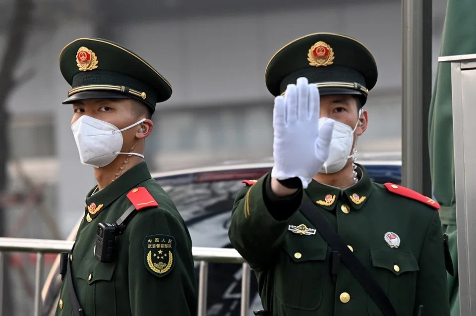 Paramilitary police stand guard south of the Great Hall of the People in Beijing, China, on 5 March 2023. (Greg Baker/AFP)