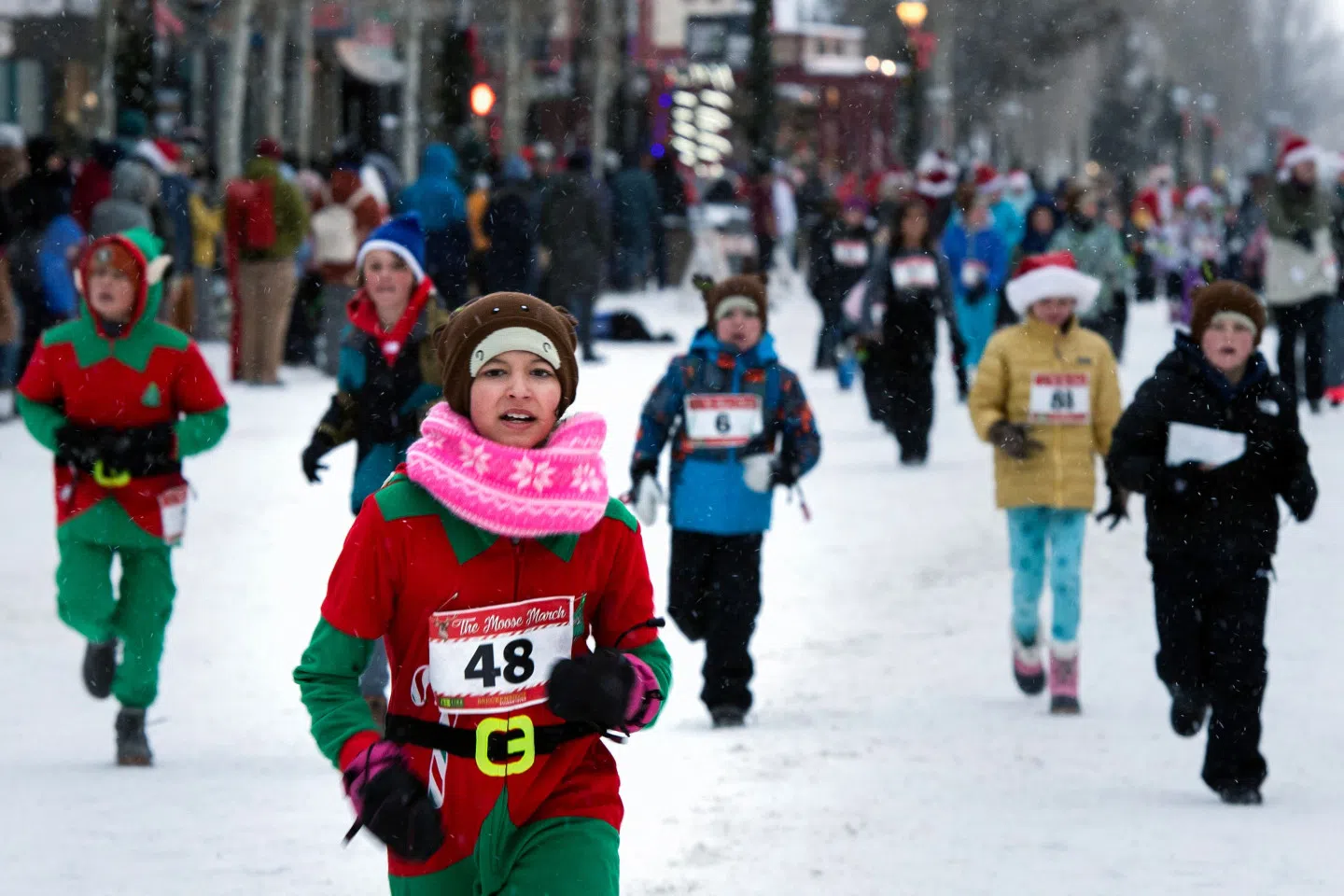 Children participate in the Moose March before the running of the Race of the Santas in Breckenridge, Colorado, on 2 December 2023. (Jason Connolly/AFP)