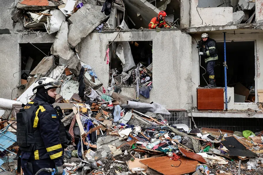 Rescuers work at the site of an apartment building which was hit by a Russian air strike in Kharkiv, amid Russia’s attack on Ukraine, on 31 October 2024. (Sofiia Gatilova/Reuters)