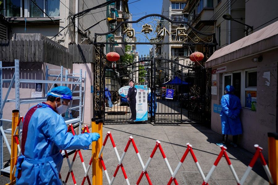 The closed entrance of a residential area is pictured during lockdown amid the Covid-19 pandemic, in Shanghai, China, 5 May 2022. (Aly Song/File Photo/Reuters)