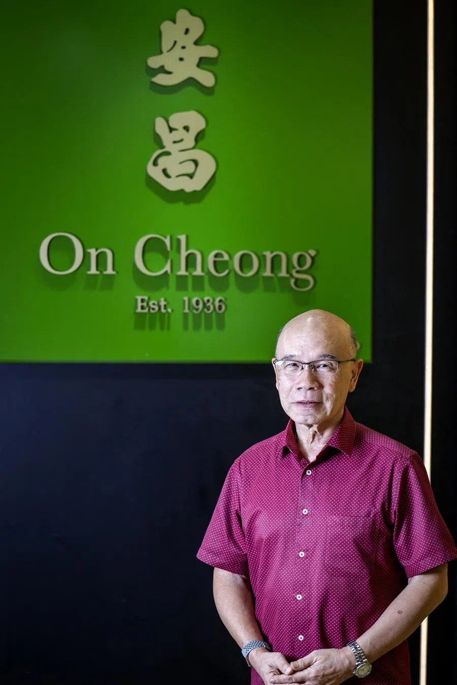 Ho Nai Chuen and the refreshed On Cheong logo. (Jonathan Yeap/SPH Media)