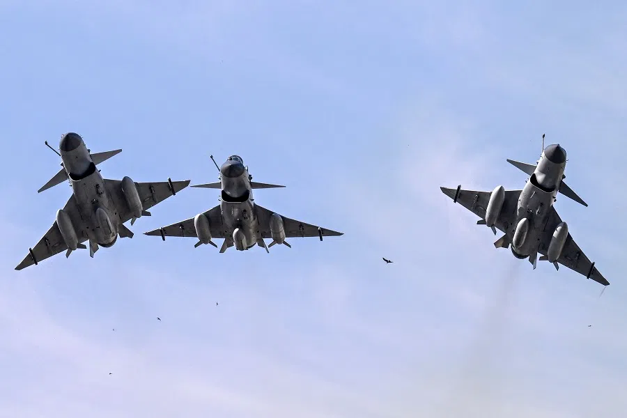 Pakistan Air Force J-10 fighter jets fly past over the President’s House during the national day parade in Islamabad on 23 March 2025.