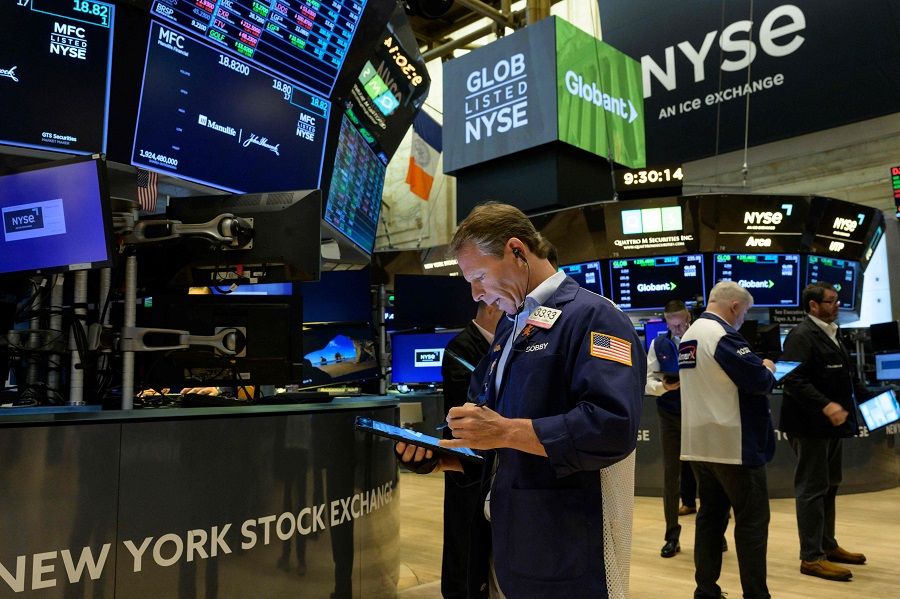 Traders work during the opening bell at the New York Stock Exchange (NYSE) on Wall Street in New York City, US, on 16 August 2022. (Angela Weiss/AFP)