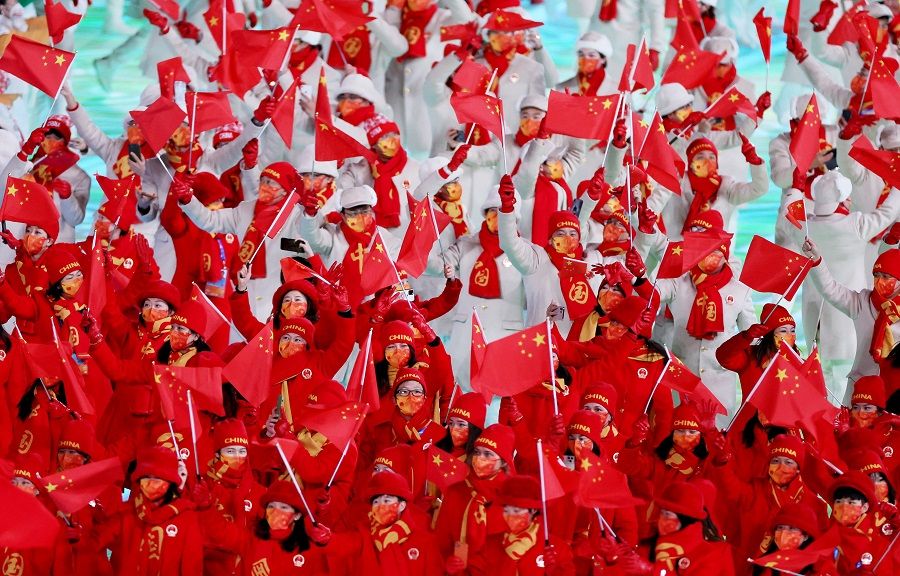 Athletes of China wave Chinese flags during the opening ceremony of the 2022 Beijing Olympics in Beijing, China, 4 February 2022. (Evelyn Hockstein/Reuters)