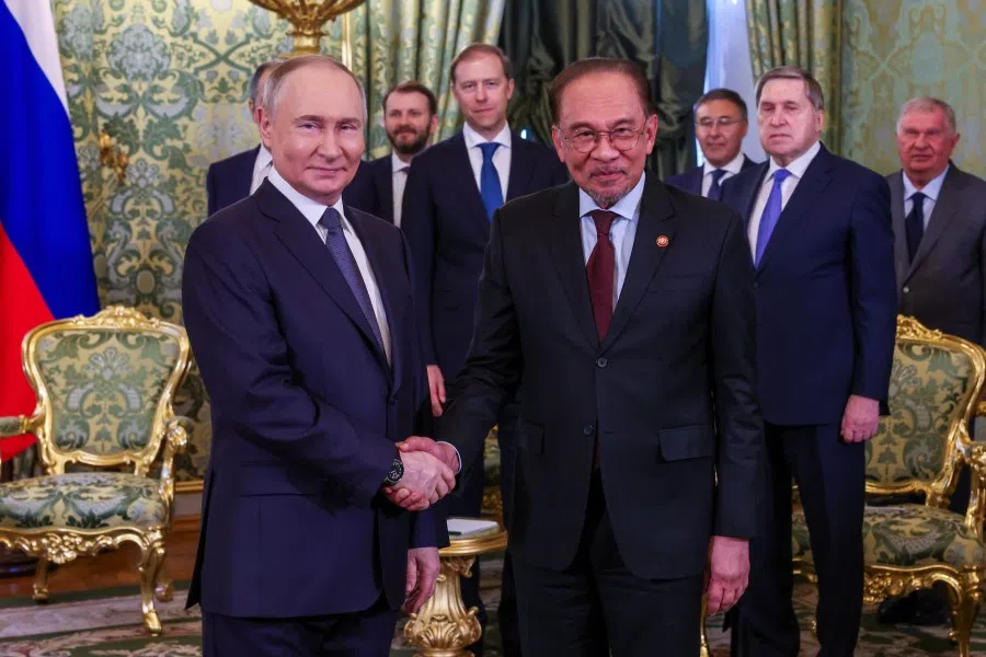 Malaysian Prime Minister Anwar Ibrahim (right) shakes hands with Russian President Vladimir Putin at the Kremlin on 14 May 2025. (FotoBernama)