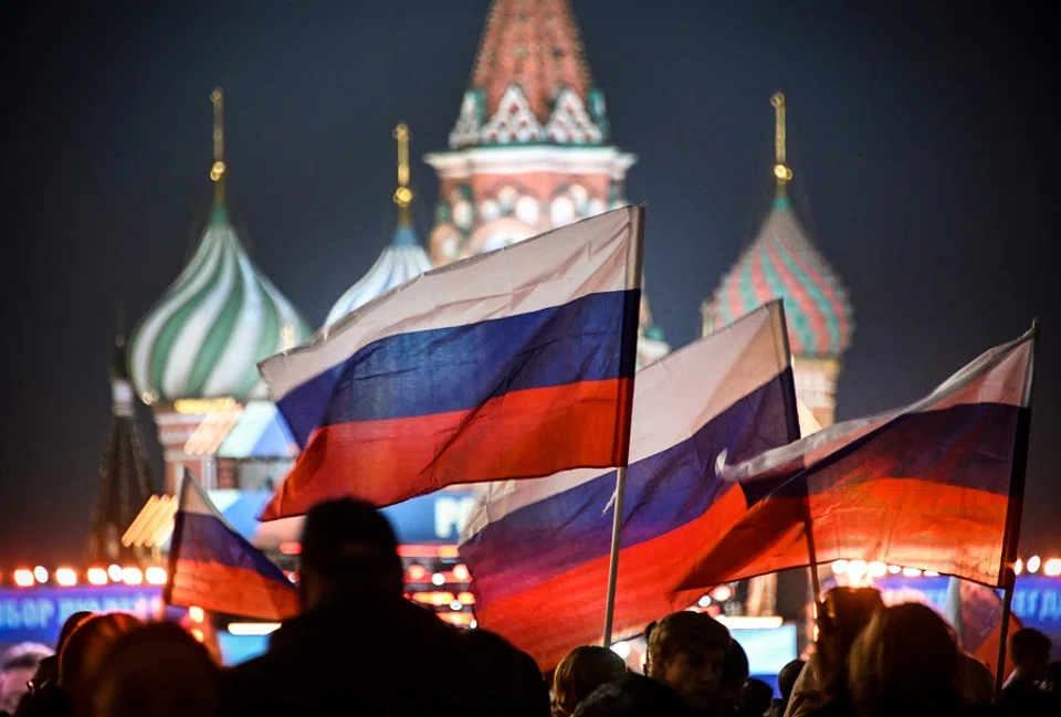 People attend a rally and a concert marking the annexation of four regions of Ukraine Russian troops occupy - Lugansk, Donetsk, Kherson and Zaporizhzhia, at Red Square in central Moscow, Russia, on 30 September 2022. (Alexander Nemenov/AFP)