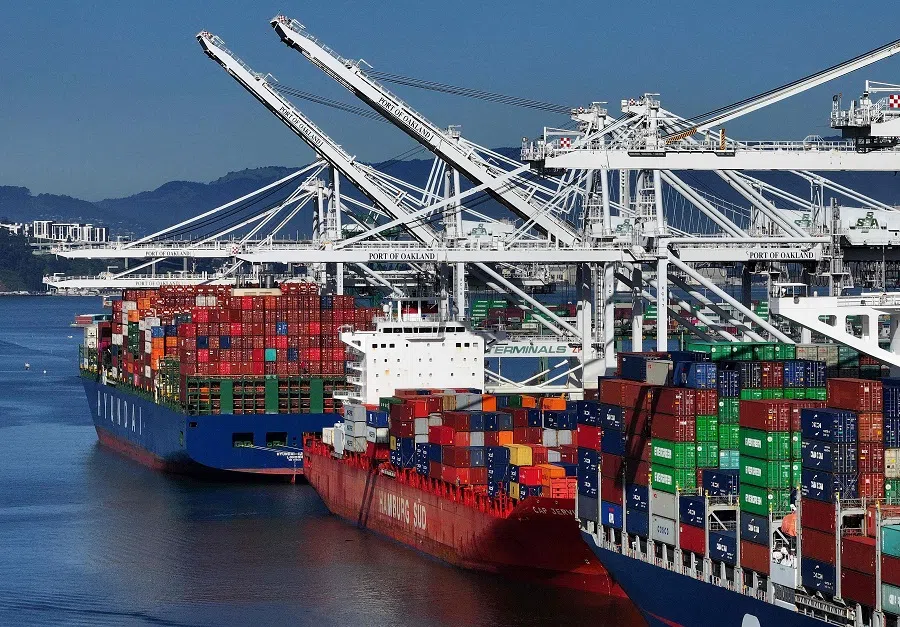In an aerial view, shipping cranes made by Chinese owned manufacturer Zhenhua Heavy Industries Company stand at the Port of Oakland on 8 March 2024 in Oakland, California, US. (Justin Sullivan/Getty Images/AFP)