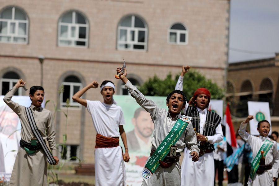 Students shout slogans during a ceremony to mark the 6th anniversary of the takeover of Yemen's capital Sana'a by the Houthi movement, in Sana'a, Yemen, 20 September 2020. (Khaled Abdullah/Reuters)