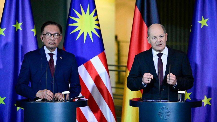 German Chancellor Olaf Scholz (right) and Malaysian Prime Minister Anwar Ibrahim address a press conference following talks at the Chancellery in Berlin on 11 March 2024. (Tobias Schwarz/AFP)