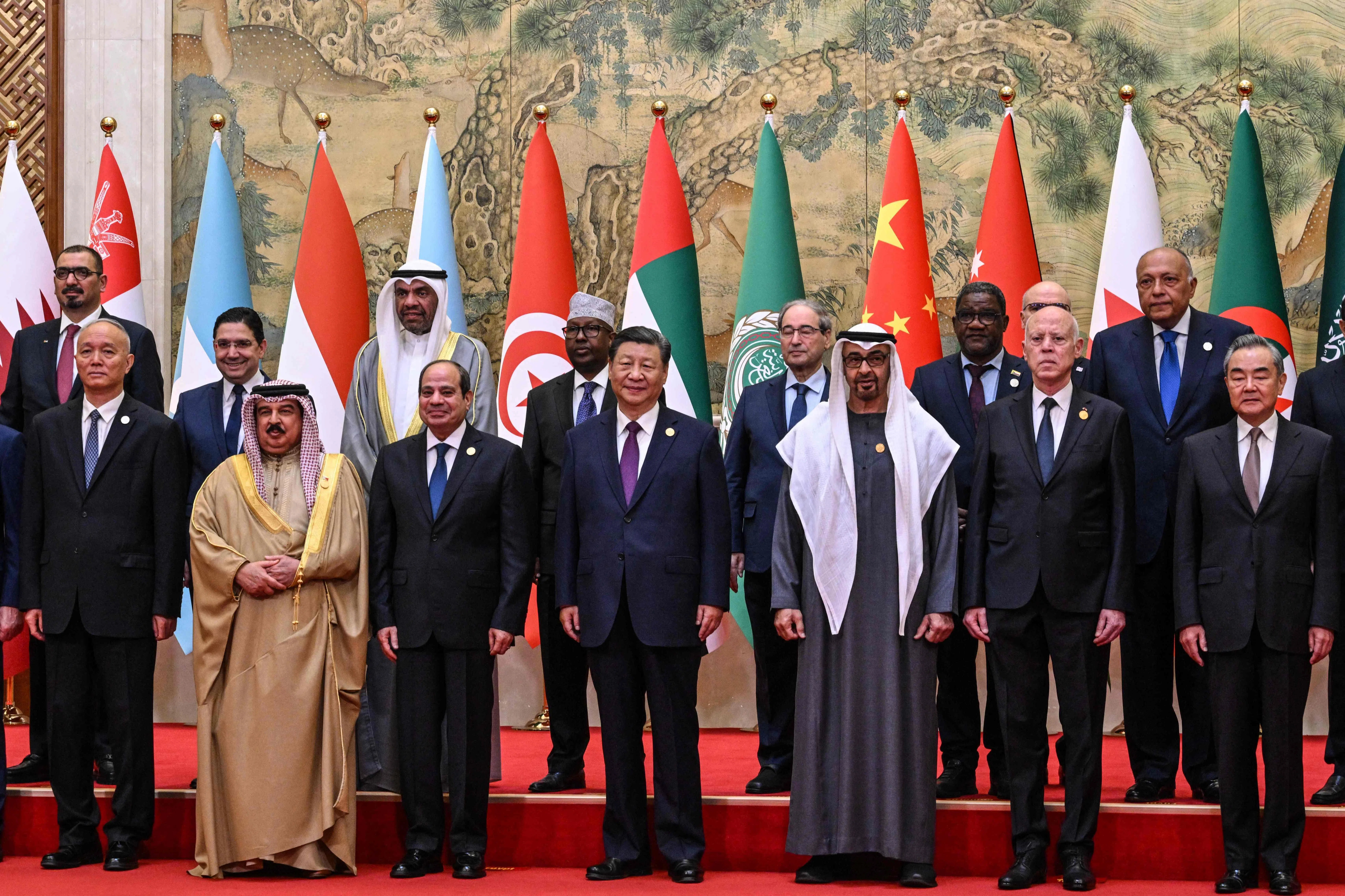 (Front row, left to right) China’s Politburo Standing Committee member Cai Qi, Bahrain’s King Hamad bin Isa Al Khalifa, Egypt’s President Abdel Fattah El-Sisi, China’s President Xi Jinping, United Arab Emirates’ President Sheikh Mohamed bin Zayed Al Nahyan, Tunisia’s President Kais Saied and China’s Foreign Minister Wang Yi pose for a family photo ahead of the opening ceremony of the 10th Ministerial Meeting of China-Arab States Cooperation Forum at the Diaoyutai State Guesthouse in Beijing on 30 May 2024.