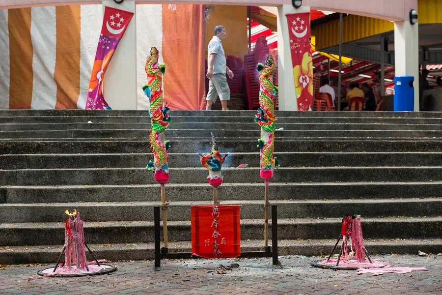 Large candles being burnt during the Hungry Ghost Festival. (Photo: Terence Heng)