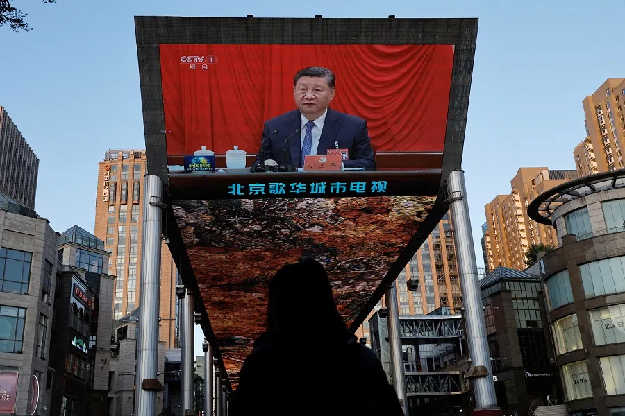 A giant screen shows news footage of Chinese President Xi Jinping attending the third plenary session of the 20th Central Committee of the Communist Party of China, in Beijing, China, on 18 July 2024. (Tingshu Wang/Reuters)