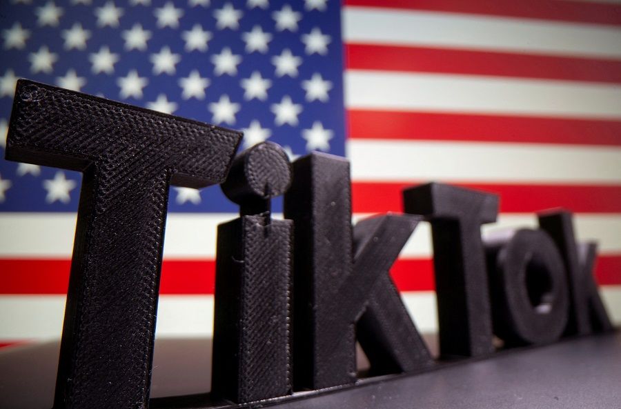 A 3D printed Tik Tok logo is seen in front of a US flag in this illustration taken 6 October 2020. (Dado Ruvic/Illustration/File Photo/Reuters)
