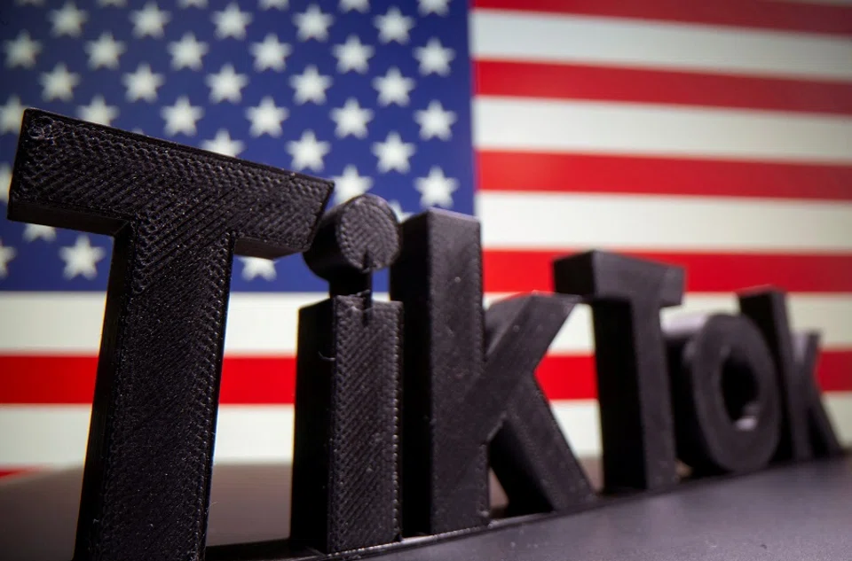 A 3D printed Tik Tok logo is seen in front of a US flag in this illustration taken 6 October 2020. (Dado Ruvic/Illustration/File Photo/Reuters)