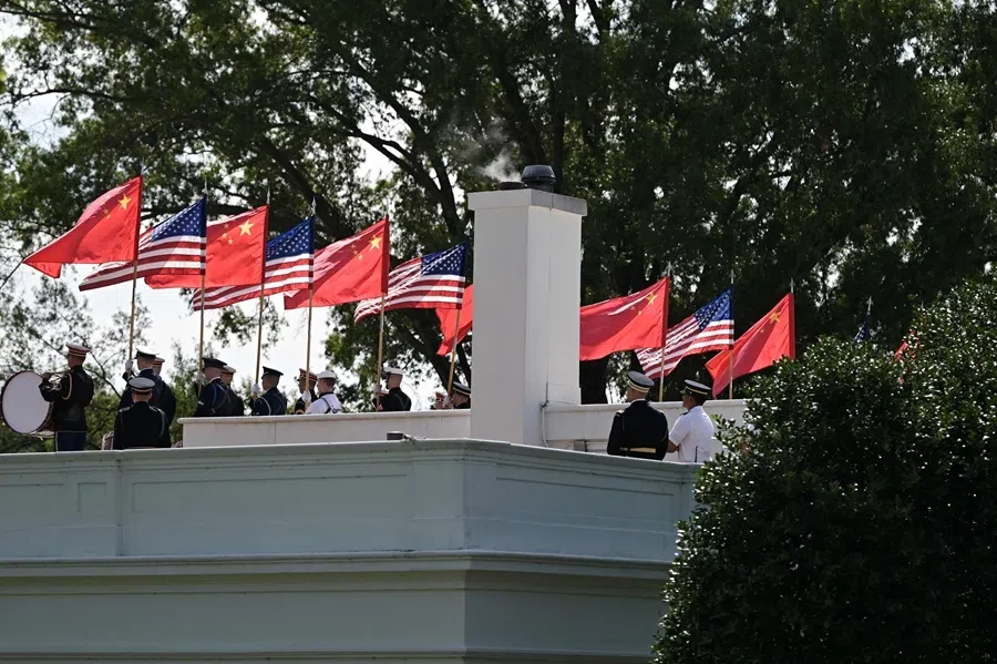 Members of the US military honor guard carry US and Chinese flags as they rehearse ahead of China's President Xi Jinpings upcoming visit to the White House in Washington, DC, on 19 September 2026.