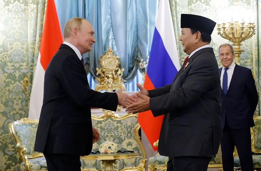 Russia’s President Vladimir Putin (left) shakes hands with Indonesia’s President-elect Prabowo Subianto as Russia’s Foreign Minister Sergei Lavrov (right) looks on during a meeting at the Kremlin in Moscow on 31 July 2024.