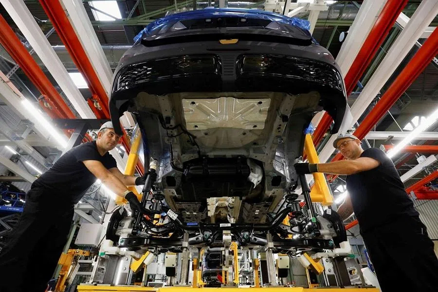 Ebro Automotive's staff work in a car assembly line at their factory in Zona Franca in Barcelona, Spain, on 14 November 2024.