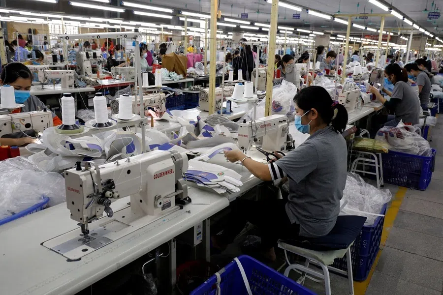Employees work at a shoe factory for export in Hanoi, Vietnam, on 29 December 2020.