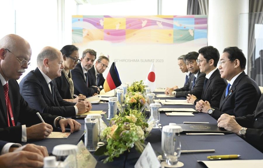 Olaf Scholz, Germany's chancellor, second from left, and Fumio Kishida, Japan's prime minister, right, during a bilateral meeting on the sidelines of the Group of Seven (G7) leaders summit in Hiroshima, Japan, on 19 May 2023. The seven countries - Japan, Canada, France, Germany, Italy, the UK and the US - are set to target what they see as economic coercion by Xi's government while also introducing measures to reach out to developing nations in the global south. (Japan Pool/Bloomberg)