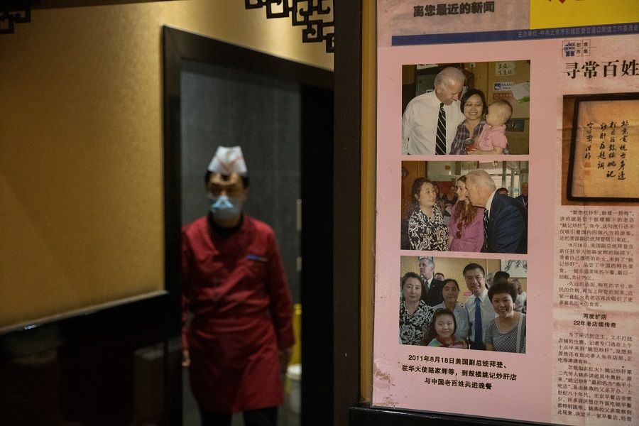 Pictures of the 2011 visit of then-US Vice President Joe Biden to the Yaoji Chaogan traditional Beijing cuisine restaurant are seen at its sister restaurant in Beijing, China, 9 November 2020. (Thomas Peter/Reuters)