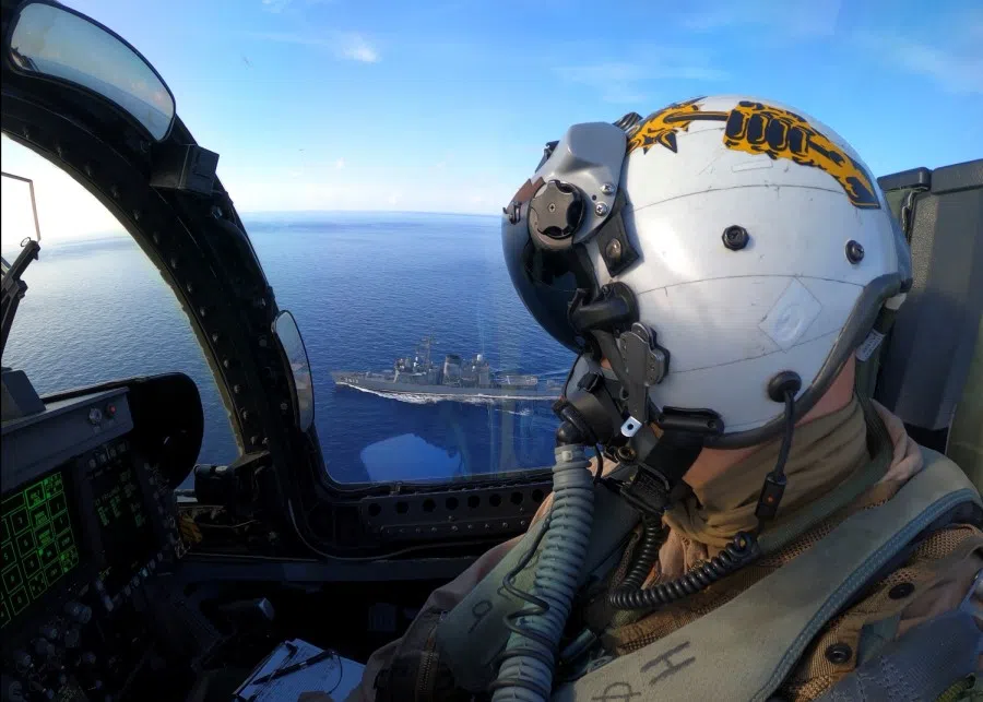A US air force pilot conducts a passing exercise in an F/A-18E Super Hornet with Japan Maritime Self-Defense Force ships in the South China Sea, 7 July 2020. (US Navy/Handout via REUTERS)