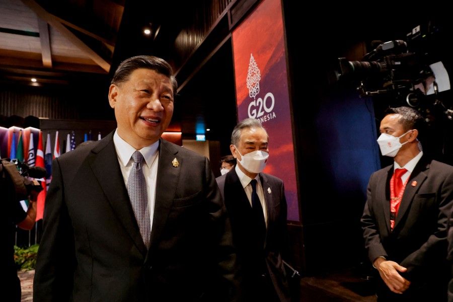 China's President Xi Jinping and China's Foreign Minister Wang Yi attend the G20 Summit in Nusa Dua on the Indonesian resort island of Bali on 16 November 2022. (Willy Kurniawan/AFP)