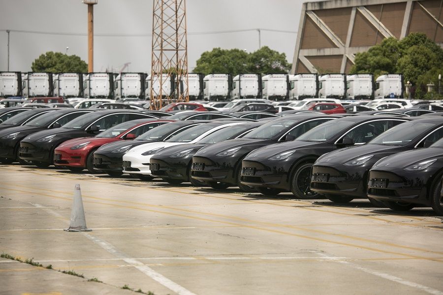 Tesla vehicles waiting for shipping transport in a large lot near the Waigaoqiao Container Terminal in Shanghai, China, on 3 June 2022. (Qilai Shen/Bloomberg)