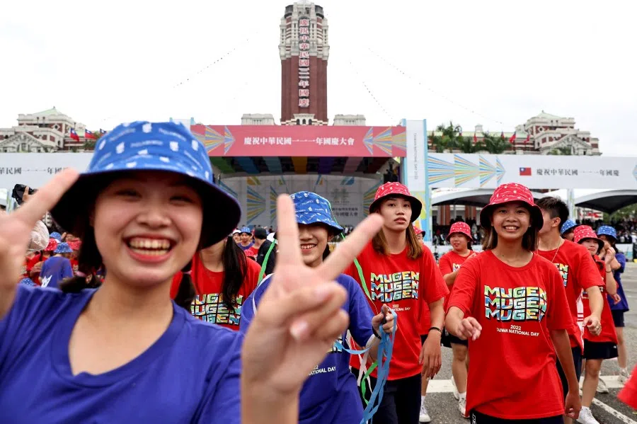 Performers pose for the camera during the National Day celebrations in front of the Presidential Office in Taipei, Taiwan, 10 October 2022. (Ann Wang/Reuters)